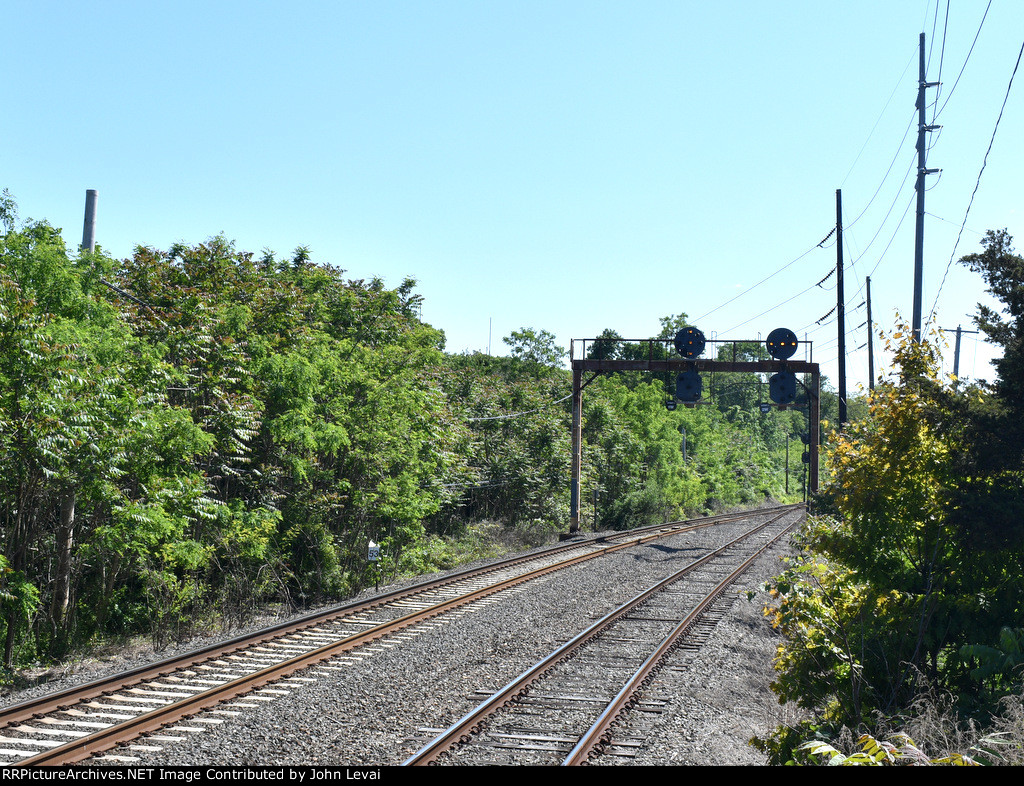 Looking east from the LIRR Stony Brook Station-another former PRR signal bridge is seen in the background